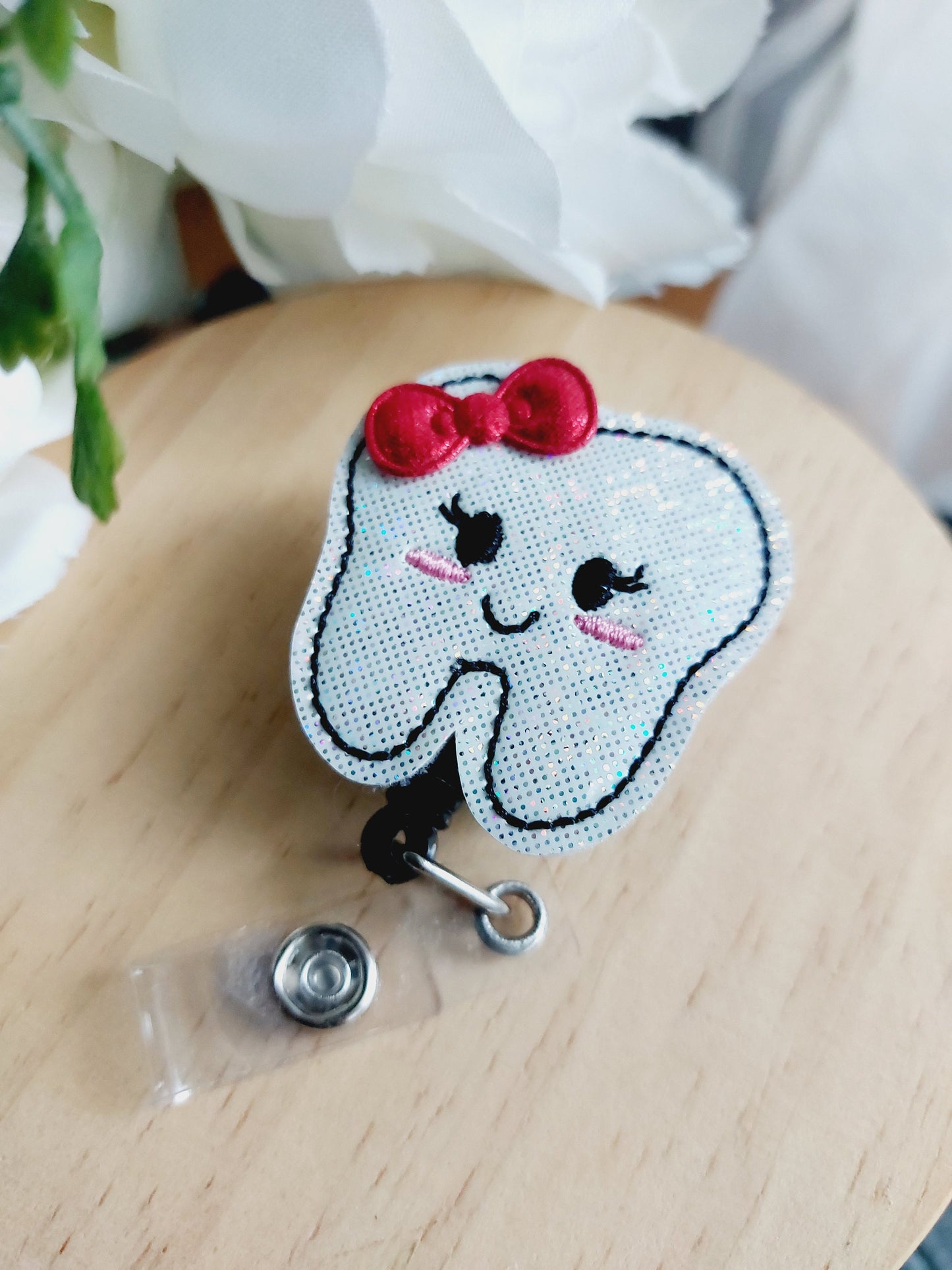 Tooth with Bow Badge Reel