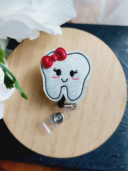 Tooth with Bow Badge Reel