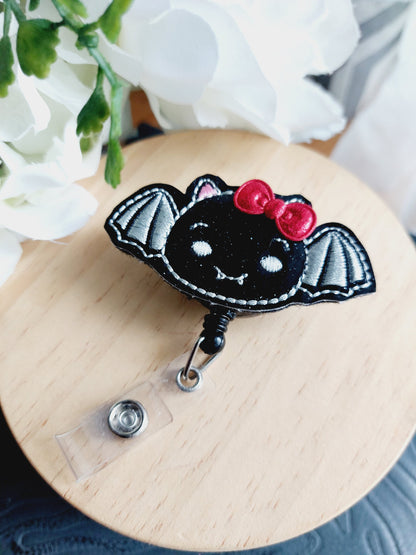 Bat with Red Bow Badge Reel