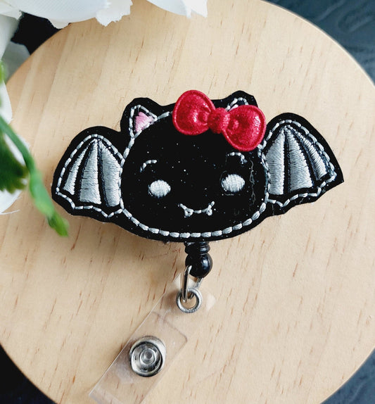 Bat with Red Bow Badge Reel