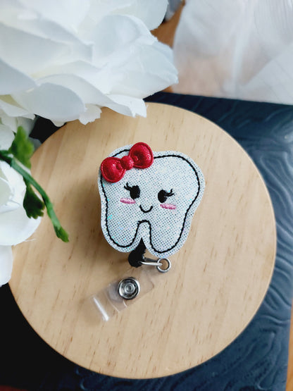 Tooth with Bow Badge Reel