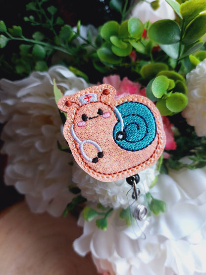 Nurse Snail Plant Badge Reel