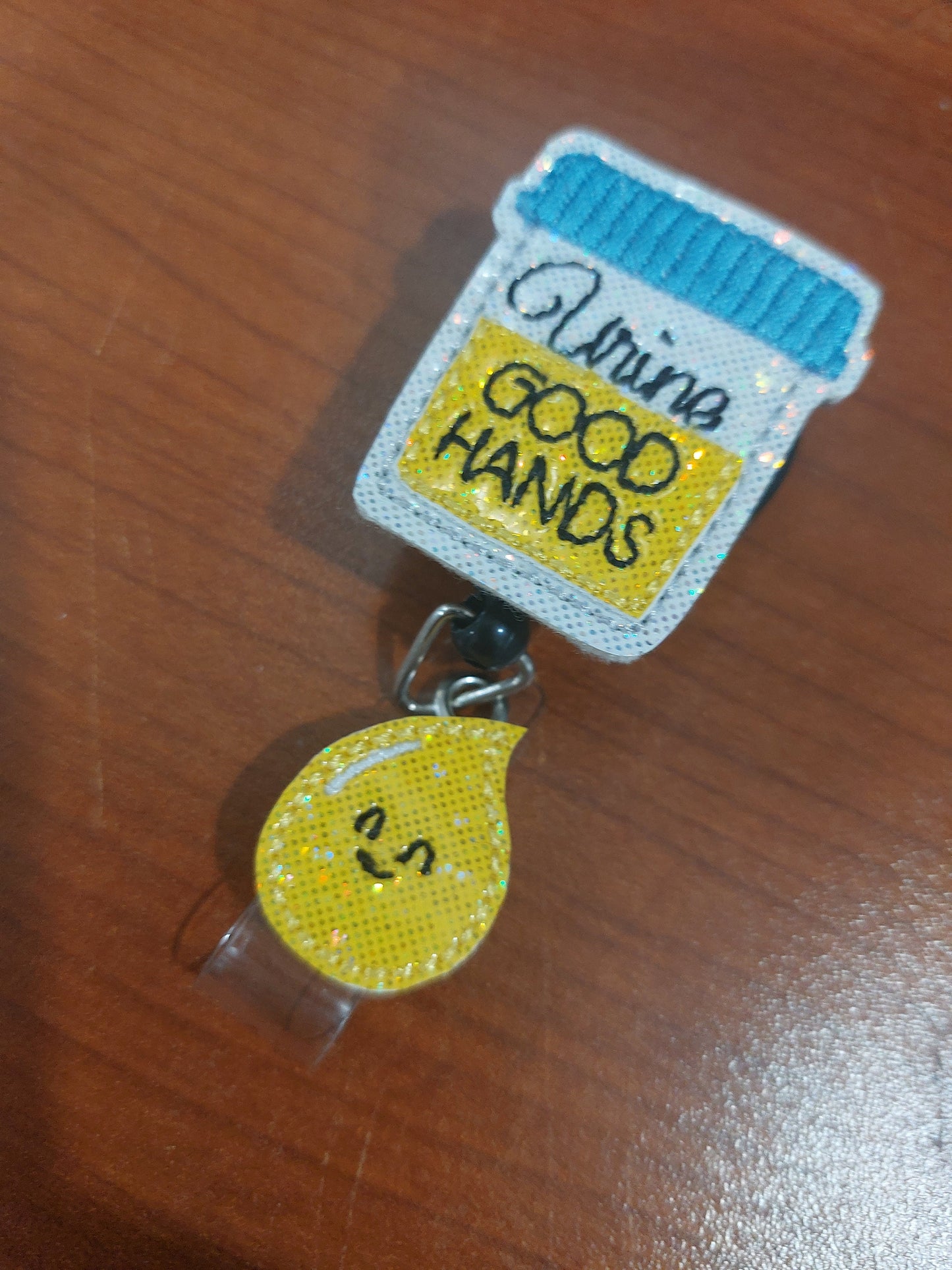 Urine Good Hands Badge Reel